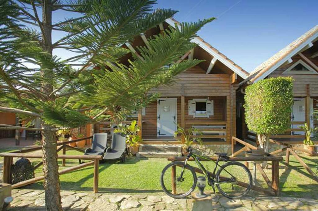 a bike parked in front of a house at Charming Bungalow in Tarifa with Mountain View in Tarifa