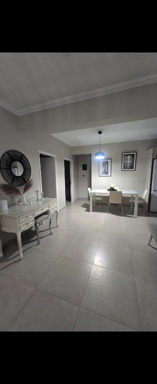 a large room with tables and benches in it at Spacious stay in Preveza