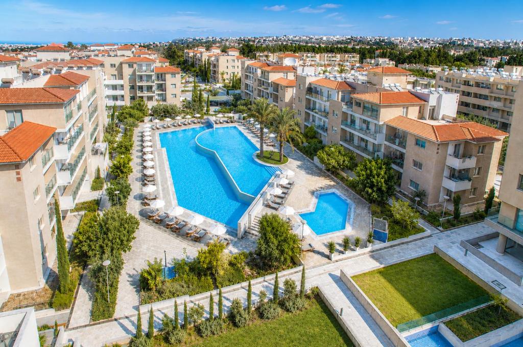 an aerial view of a swimming pool in a city at Elysia Park in Paphos