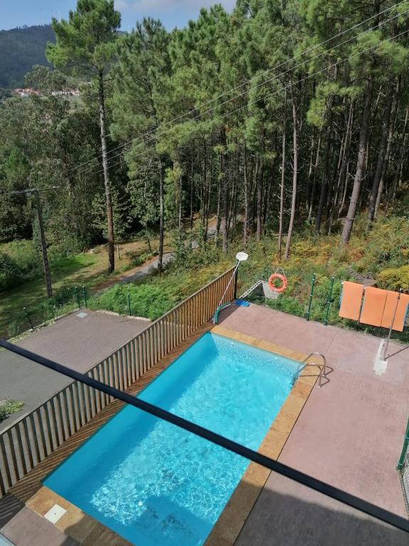 a swimming pool on the balcony of a house at Elegant Villa in Outes with Pool in Serantes