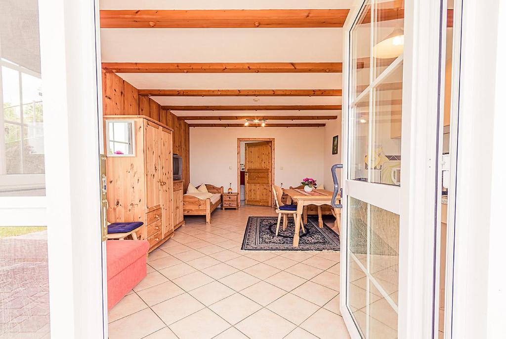 a view of the living room and dining room from the door at Dorfstube in Abtsgmünd