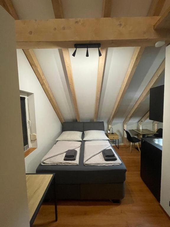a bed in the middle of a room at Modernes und schönes Apartment VS in Villingen-Schwenningen