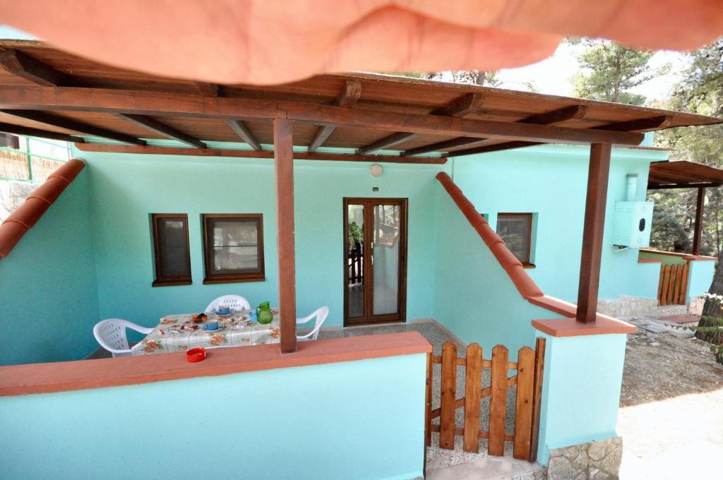 a model of a house with a roof at Charming Studio in Vieste, 25 m², Shared Pool in Vieste