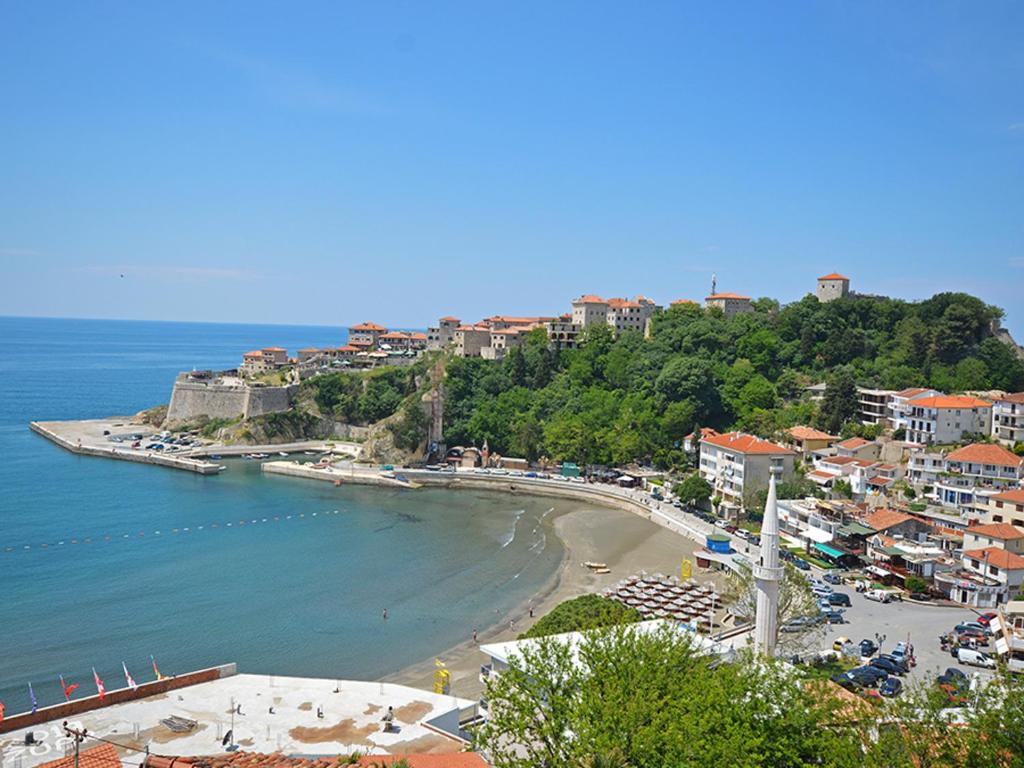 a view of a beach with buildings and the ocean at Modern Studio with Sea View - Ulcinj - 25 m² - Balcony in Ulcinj