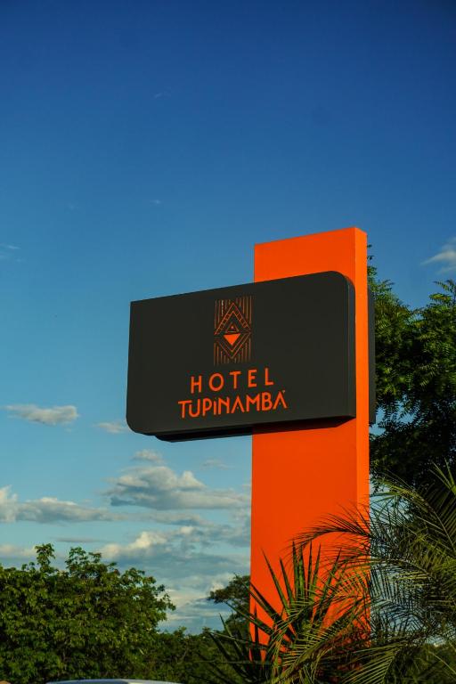 a sign for a hotel tokushimaachiachi at Hotel Tupinambá Timon in Timon