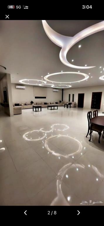 a large room with tables and chairs in it at ريفون in Tabuk