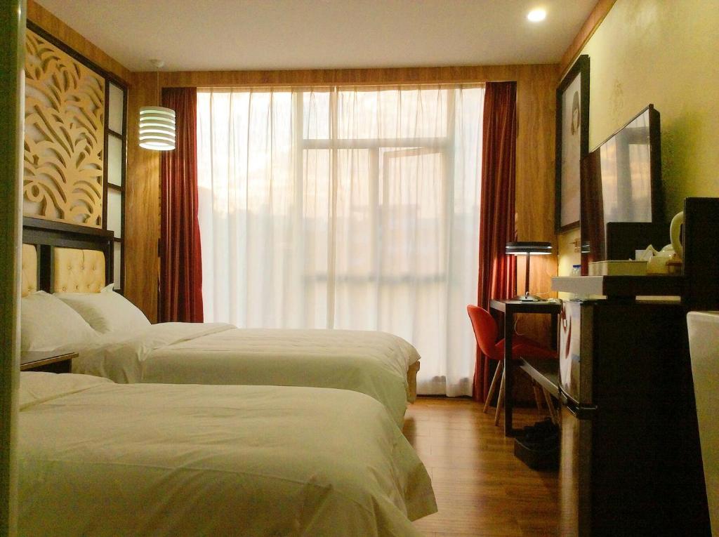 Postel nebo postele na pokoji v ubytování Guangzhou Bird Island Hotel