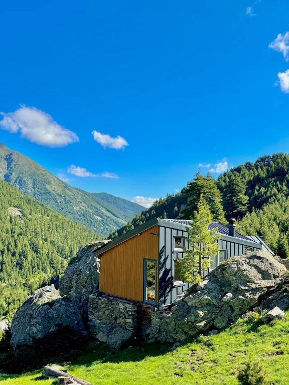 a house on a rock on a mountain at Cabin on a Rock - Mountain Escape in Deçan