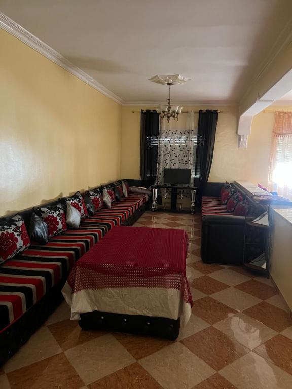 a large living room with couches in a room at Hrich house in Fnidek