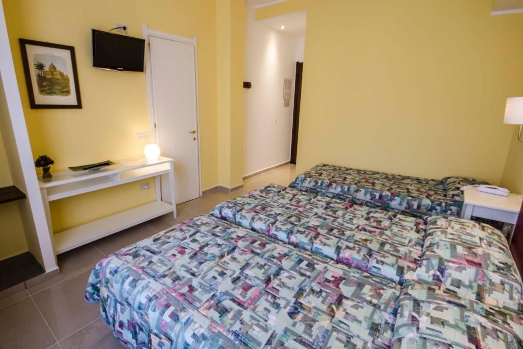Postel nebo postele na pokoji v ubytování Hotel Tarconte