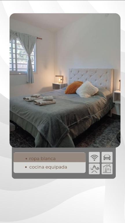 a screenshot of a bedroom with a bed in a room at El Cañaveral in Capilla del Monte