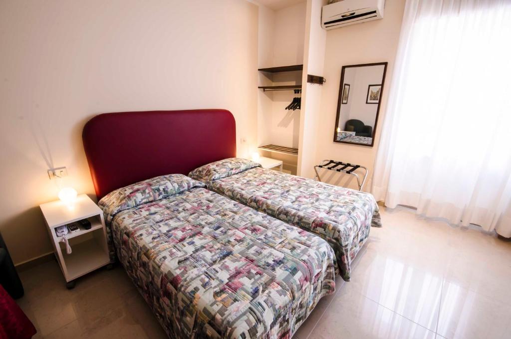 Postel nebo postele na pokoji v ubytování Hotel Tarconte