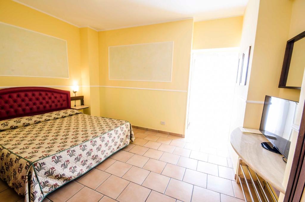Postel nebo postele na pokoji v ubytování Hotel Tarconte