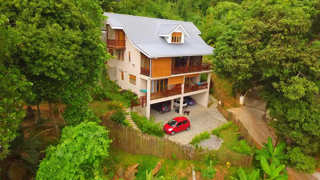 an overhead view of a house with a red car parked in front at Fler Payanke Apartment in Anse Royale