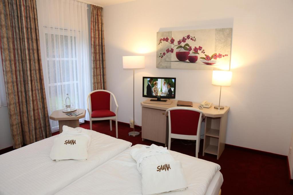 TV a/nebo společenská místnost v ubytování Lindenhotel Stralsund
