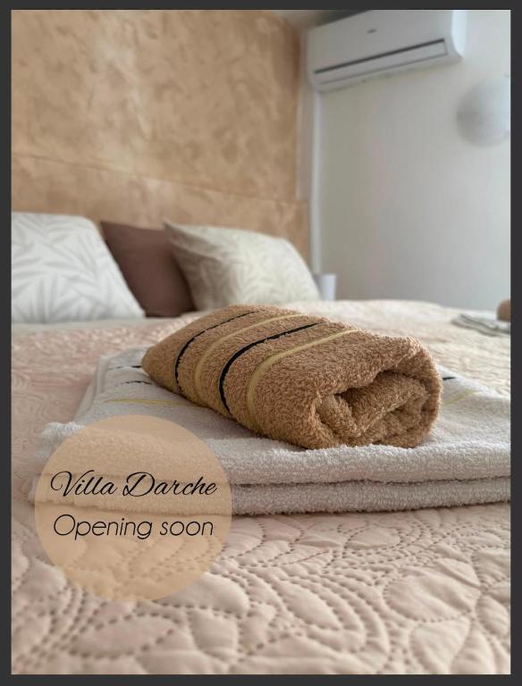 a pair of towels sitting on top of a bed at Villa Darche in Vrbnik