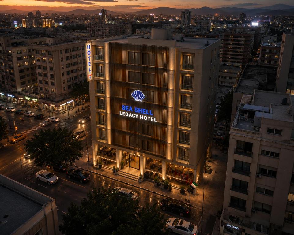 a building with a sign that reads reisel energy hotel at Seashell Legacy Hotel in Karachi
