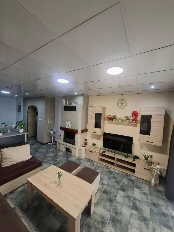 a living room with a couch and a table at Kombfapartment in Berkovitsa