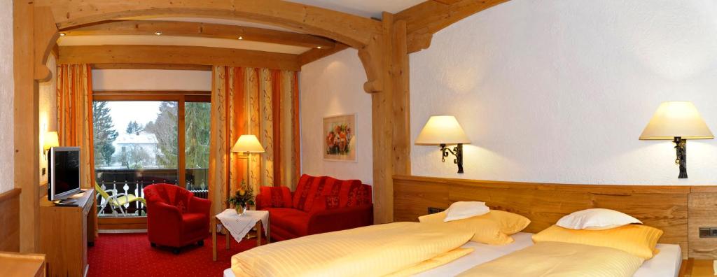Postel nebo postele na pokoji v ubytování Kurhotel Eichinger
