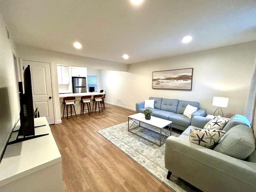 a living room with a couch and a table at The Porter Chamber in Ocean Springs