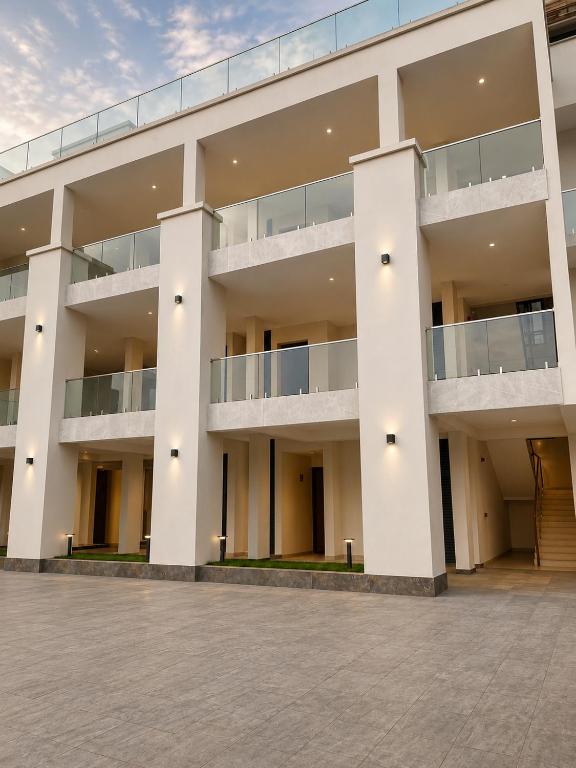 an external view of a large white building at Mia Bella Madre Morogoro in Morogoro