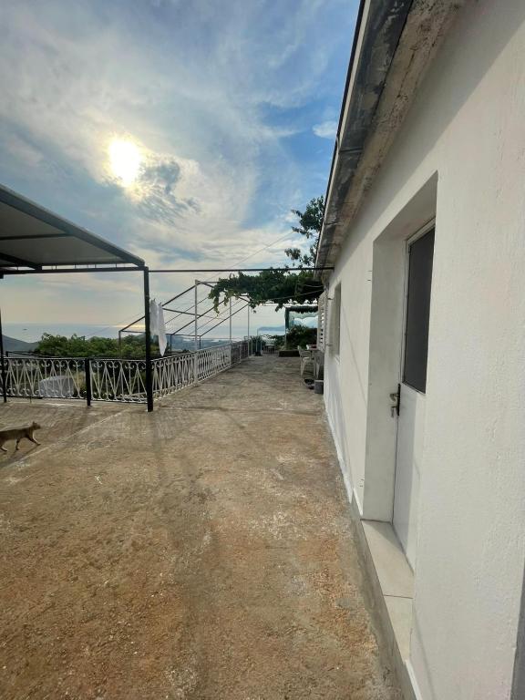 a balcony of a building with a view of the ocean at Apartman Metovic in Bar