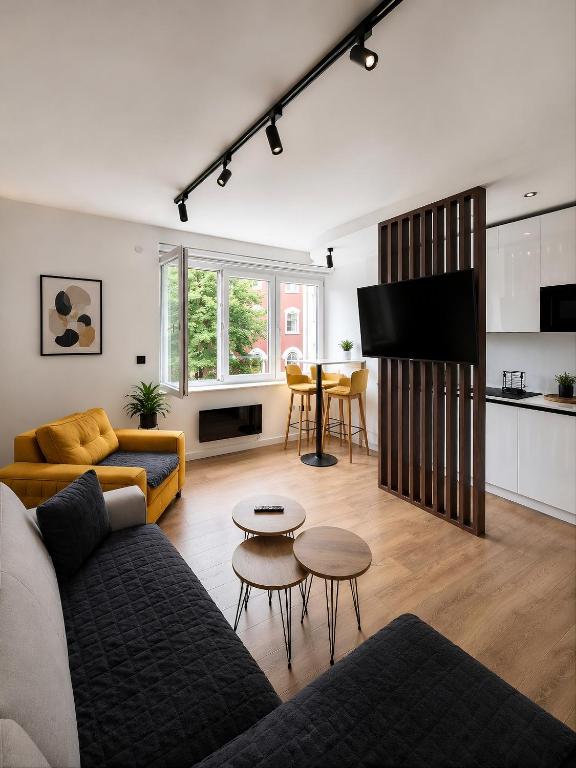 a living room with a couch and a table at Heart of Sarajevo - Baščaršija Private Garage in Sarajevo