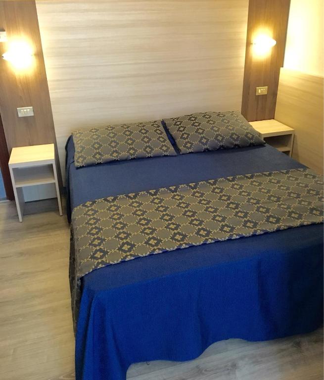 Postel nebo postele na pokoji v ubytování Hotel Della Motta