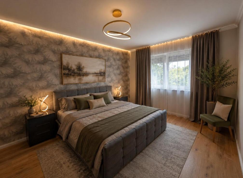 a bedroom with a large bed and a window at Waldresidenz Lutz in Bad Lippspringe
