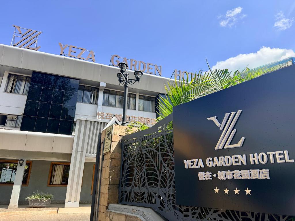 a hotel sign in front of a building at Yeza Garden Hotel in Nairobi