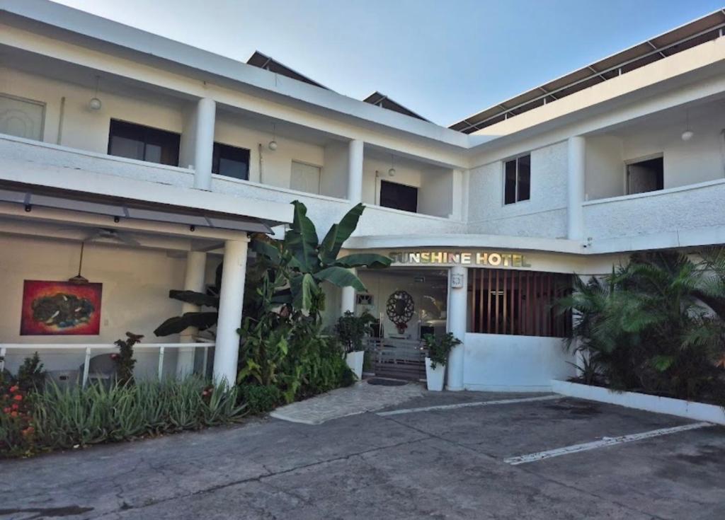 a hotel with a sign that reads welcome hotel at Sunshine Hotel - Puerto Plata in San Felipe de Puerto Plata