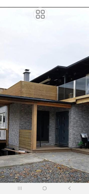 a building with a deck on top of it at 1 sleeping room in Fagernes