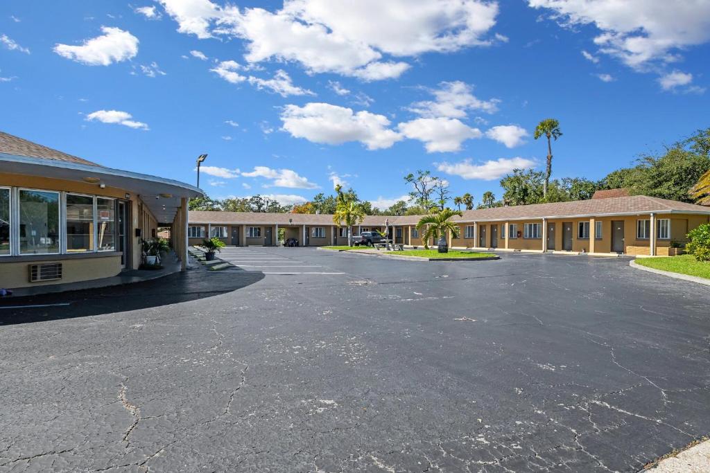 an empty parking lot in front of a motel at Lumina Motel in Daytona Beach
