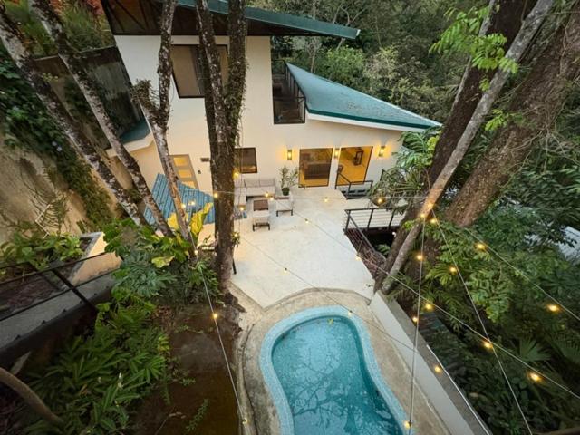 an overhead view of a swimming pool in a garden at Sal y Sol in Quepos