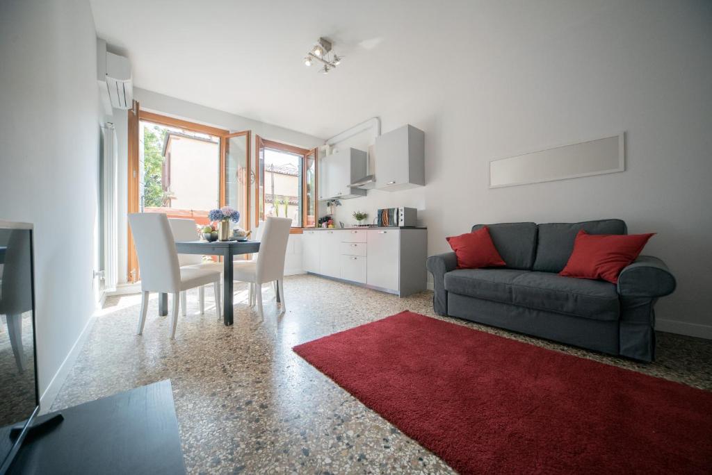 a living room with a couch and a table at Venier Apartment in Venice