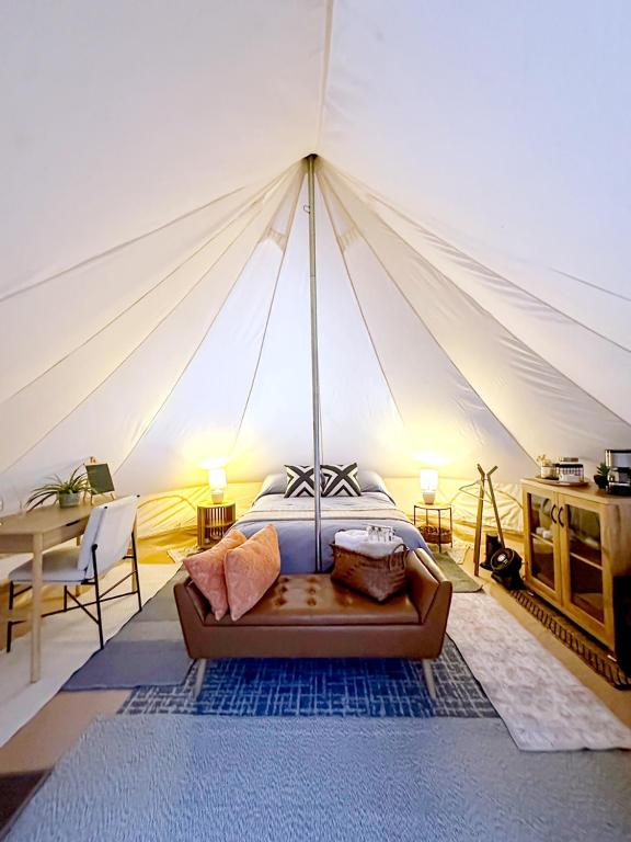 a bedroom with a bed in a tent at Glamping Rivera del Mar - RV Park in Loreto