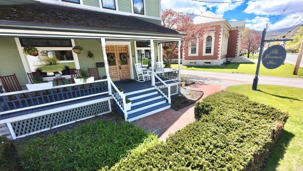a house with a porch with blue steps at The Governor's Inn in Ludlow
