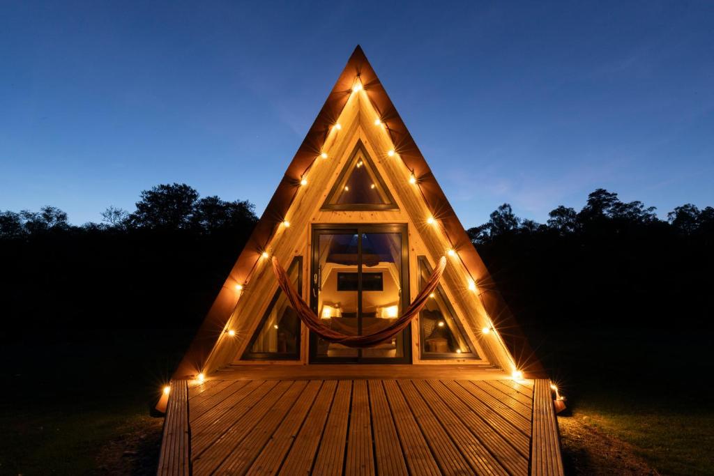 a cabin with a window with lights on it at Ben Nevis Basecamp in Torlundy
