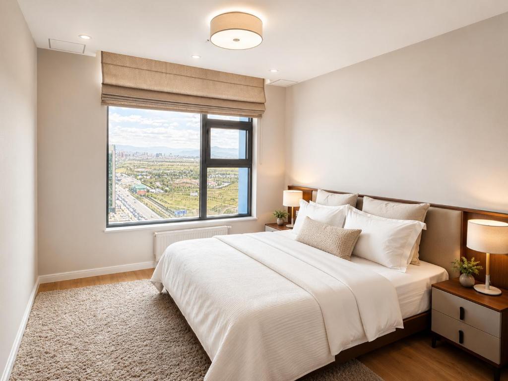 a bedroom with a large bed and a large window at Mandala 365 Residential Tower in Ulaanbaatar