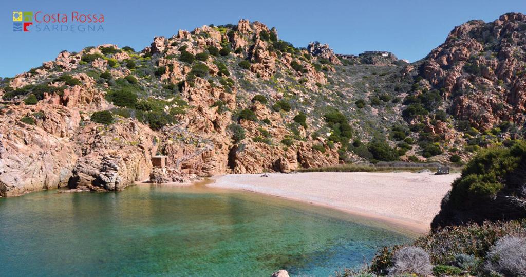 a view of a beach with a mountain at Villa Paradiso holidays in Costa Paradiso