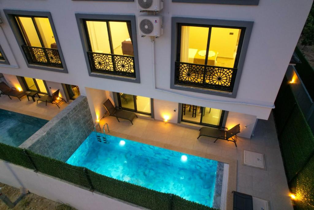an overhead view of a building with a swimming pool at Villa A1 Canpare in Fethiye