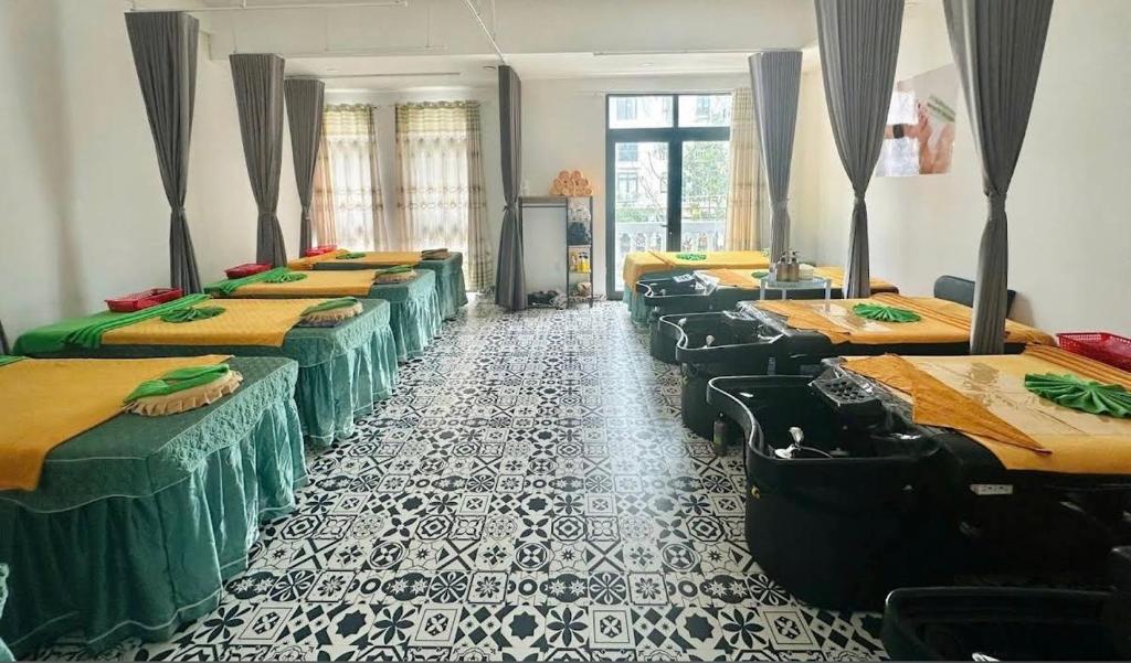 a room with a bunch of beds in it at lotusan in Phú Quốc