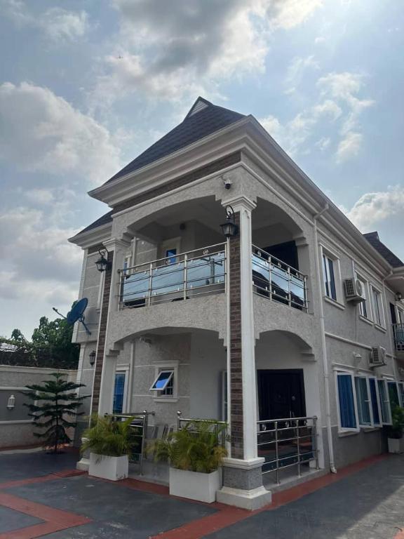 a large building with a porch and a balcony at Hayorttas Apartment in Cardoso