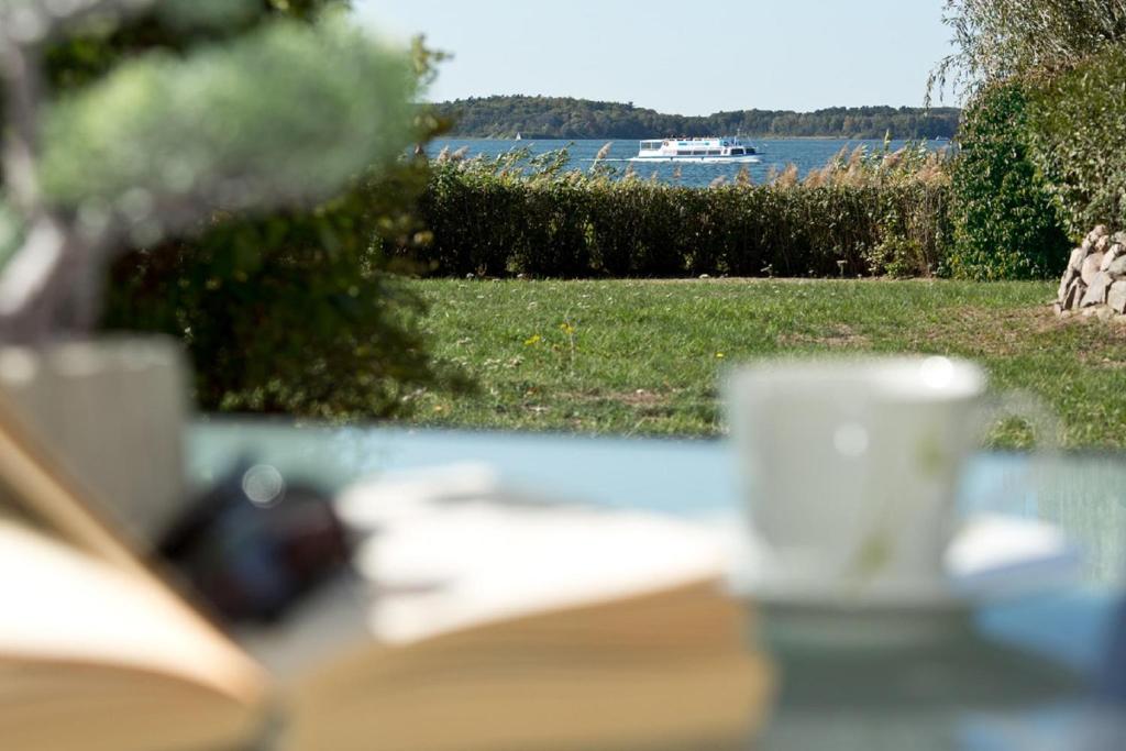 a close up of a table with a cup of coffee at Am Seeufer 59b Fewo 3 in Waren