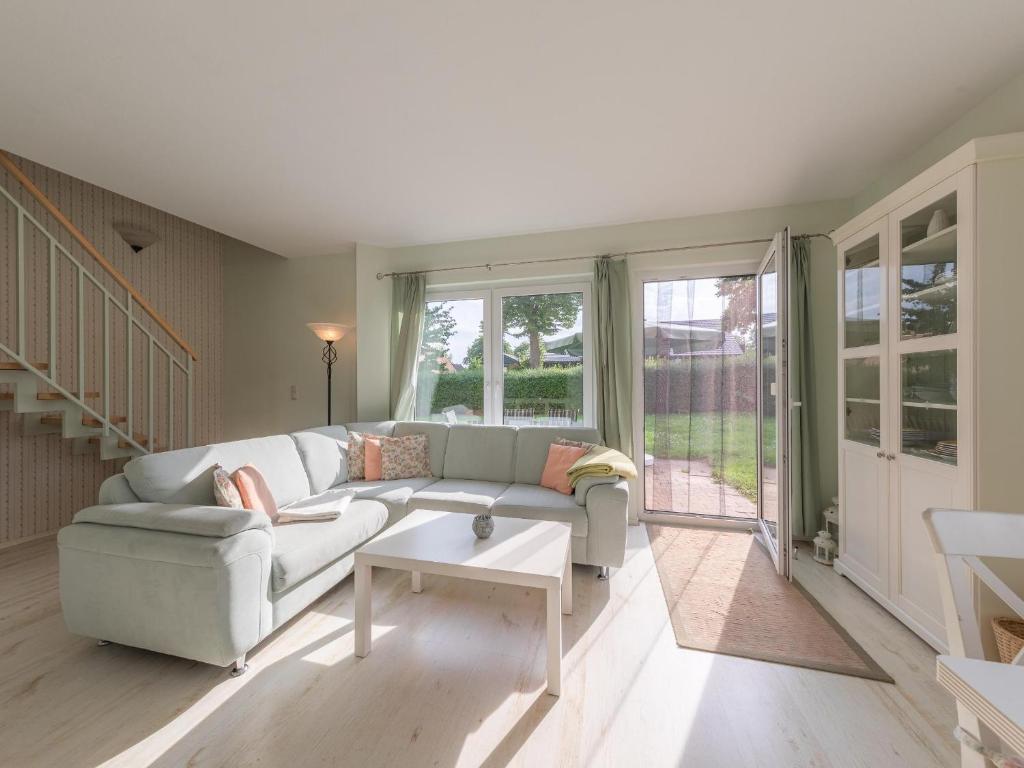 a living room with a couch and a table at Kornblume_DH in Röbel