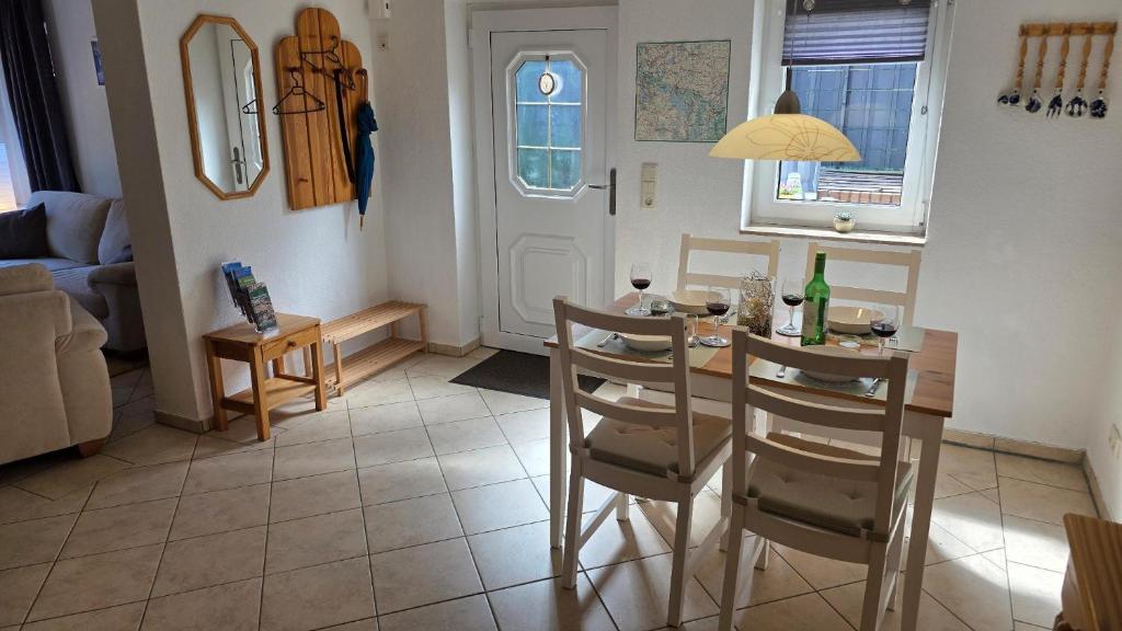 a kitchen and living room with a table and chairs at Ferienhaus Wennmann in Waren