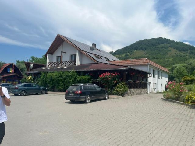 a car parked in a parking lot in front of a building at Tranzit in Mihai Viteazu