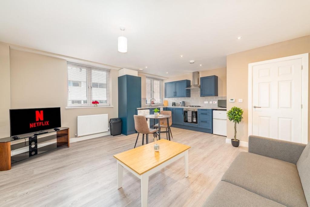 a living room with a couch and a table at 1 bed flat in Wolverhampton city centre in Wolverhampton
