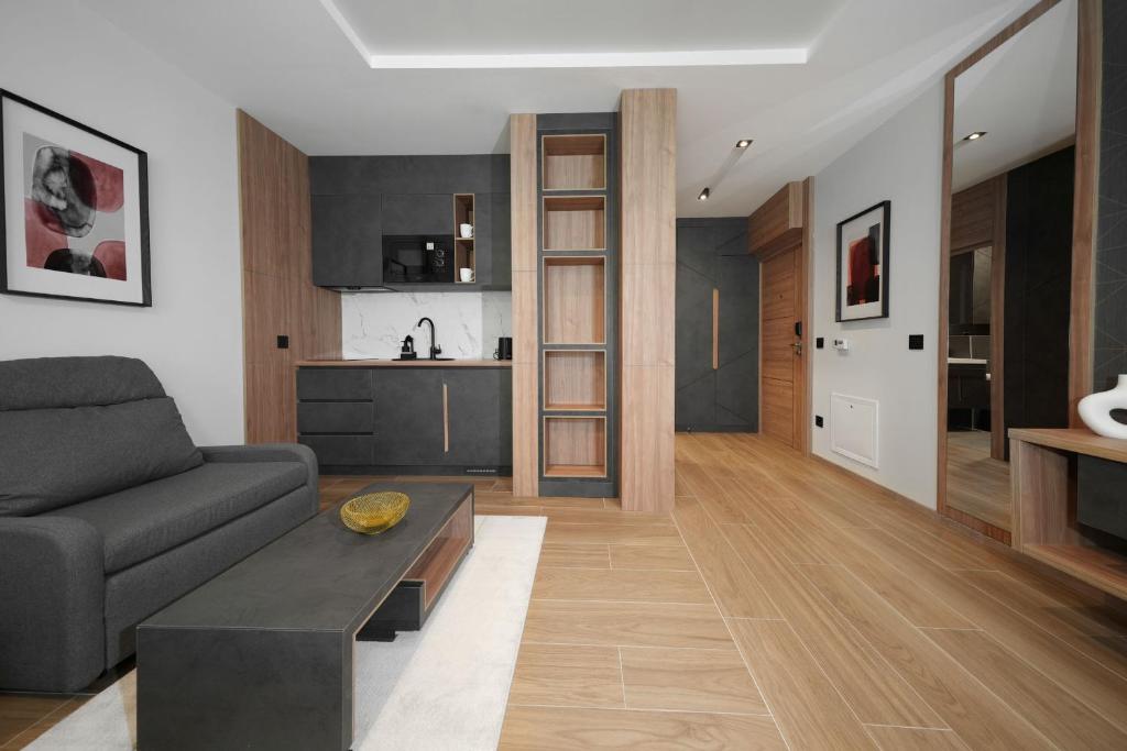 a living room with a couch and a table at Panorama Mountain Tara in Kaludjerske Bare