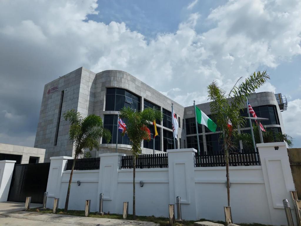 a building with flags in front of it at Treal Hotels & Suites in Abeokuta